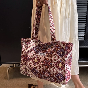 Ethnic style geometric woven tote bag for women with vibrant bohemian patterns