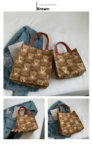 Brown canvas tote bag set with cute cartoon bear pattern and leather handles detail
