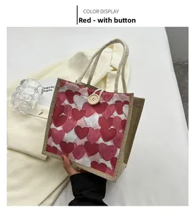Close-up of heart pattern linen lunch bag with rustic rope handle and wood button closure