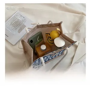 Inside view of linen tote bag showing large capacity for phone, umbrella, and water bottle