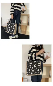 Linen tote bag with cow print pattern and jute sides shown in a home setting