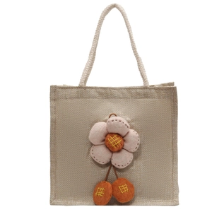 Minimalistische Lunch-Tasche aus Leinen mit rosa Stoffblume und orangefarbenen Pompons