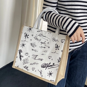 Linen tote bag with black LA graffiti print and braided rope handles for women
