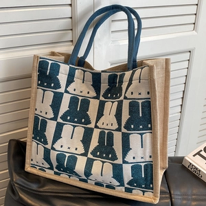 Large checkered tote bag with rabbit patterns and navy braided handles for daily use
