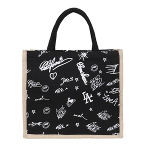 Black canvas tote bag with white graffiti print and beige linen trim for daily shopping