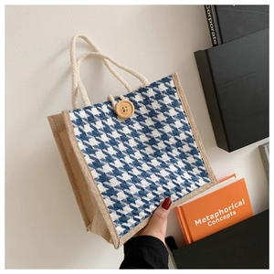Close-up of blue houndstooth linen tote bag with wooden button and cotton rope handles