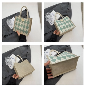 Detail view of rhombic pattern canvas tote bag with wooden button and linen texture fabrics