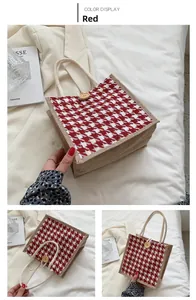 Detail of red houndstooth jute tote bag featuring a round wooden buckle and cotton rope handle