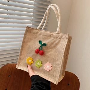 Fresh summer jute mini tote bag featuring handmade crochet cherry and floral patterns