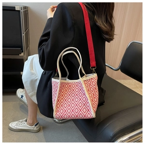 Detailed shot of the geometric red and white pattern on the casual fabric tote bag