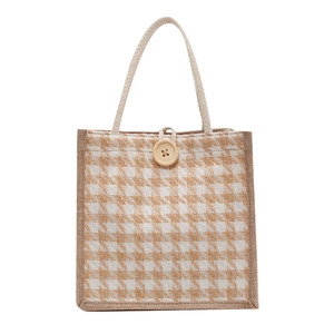 Linen tote bag with classic houndstooth pattern and natural wood button closure