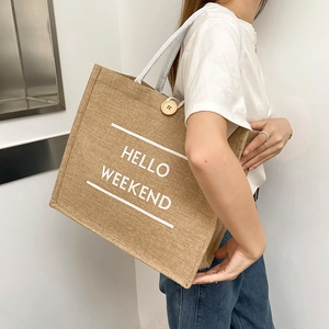 Large jute tote bag with Hello Weekend print and wooden button closure for women