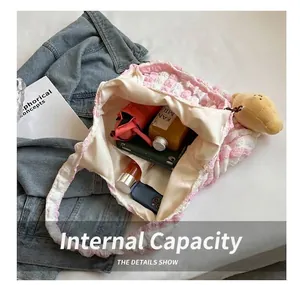 Spacious interior of a pink checkered popcorn fabric tote bag with daily essentials