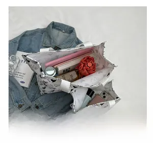 Interior view of canvas tote bags set with heart print showing large storage capacity