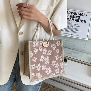 Sac à déjeuner chic en toile beige avec broderies florales et anses tressées
