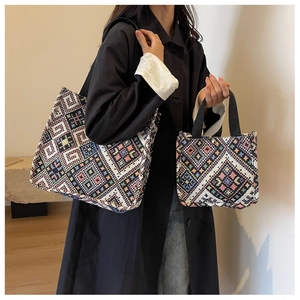 Macro detail of high-quality ethnic pattern embroidery on canvas tote bags
