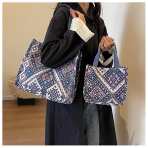 Detailed comparison of large and small woven canvas tote bags with ethnic patterns
