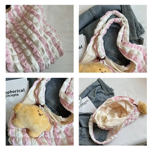 Detail shots of pink pleated puff bag fabric, soft inner lining and plush doll charm