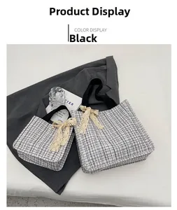 Detail view of large checkered canvas tote bags with elegant white lace bow decorations
