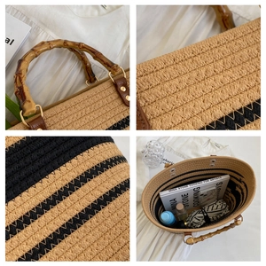 Detail of straw woven tote showing bamboo handles and large interior capacity