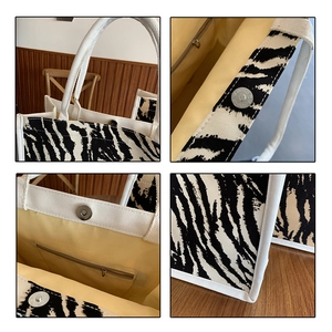 Dettagli della borsa in tela zebrata con chiusura magnetica e tasca interna con cerniera