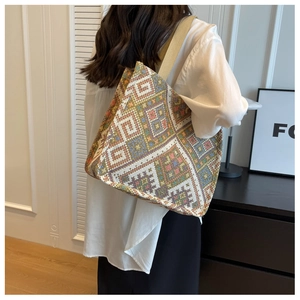 Detail view of woven ethnic geometric pattern texture on large canvas tote bag
