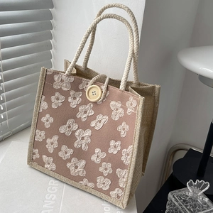 Chic woven tote bag with pink fabric patch and 3D floral accents for women