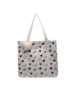 Large white canvas tote bag with black heart prints and a fluffy heart pendant charm