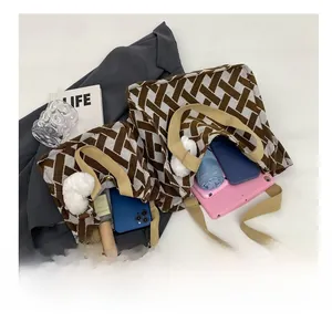 Detail view of large capacity knit tote bag showing spacious interior with daily essentials