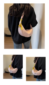 Pink crescent canvas bag with pleated texture and a cute yellow duck charm detail