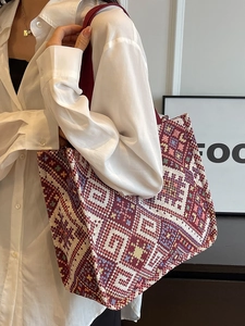 Ethnic geometric canvas tote bag with large capacity for women shown on shoulder