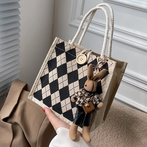 Chic checkered linen tote bag with sturdy rope handles and a cute bunny plush charm