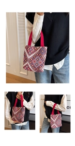 Detail showing colorful geometric jacquard texture and red ribbon handle of a retro handbag
