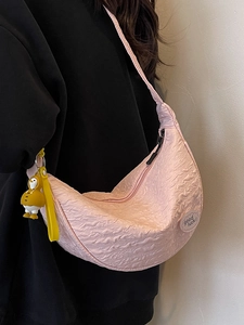 Pink bubble texture crescent crossbody bag with cute penguin pendant and lucky badge