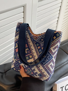 Ethnic style canvas bucket bag with geometric diamond weave and navy blue top handle