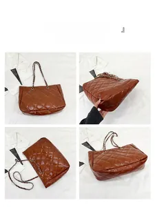 Detail view of large brown quilted tote bag with silver chain straps for daily commute
