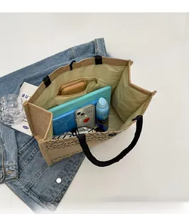 Spacious interior of jute tote bag showing zippered pocket and daily essentials storage