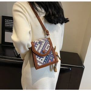 Retro crossbody phone bag with ethnic jacquard pattern and plush bunny charm detail