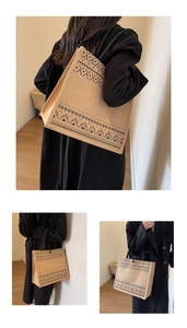 Detailed close-up of large linen tote bag with black geometric ethnic patterns