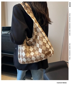 Detail of checkered canvas tote bag showing large capacity and fashion label on shoulder