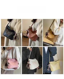 Detailed views of vintage butterfly embroidered tote bags in various colors on a model