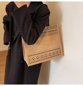Close-up of linen tote bag with black geometric ethnic patterns and bohemian design