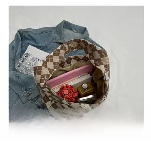 Top view of large capacity argyle pattern bag showing iPad, umbrella and daily essentials
