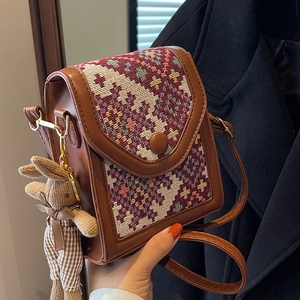 Brown PU leather crossbody bag featuring geometric woven flap and cute rabbit charm