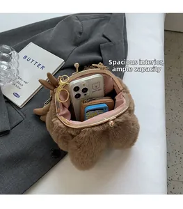 Brown faux fur plush bag interior with gold clasp frame showing spacious storage space
