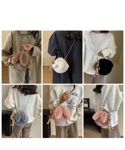 Detail view of plush rabbit crossbody bags with metallic chains and cute bunny pendants