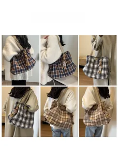 Detail of checkered woolen tote bags with cute bunny charms in three stylish colors