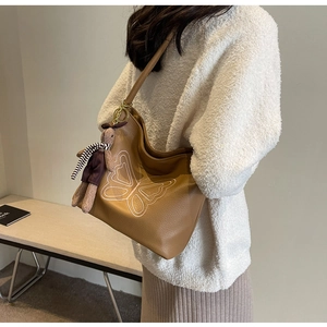 Brown leather Hobo tote bag featuring white butterfly embroidery and cute rabbit charm