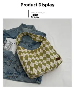 Detail of fruit green and white canvas tote bag with fashion tag on denim background