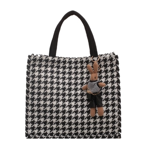 Large capacity houndstooth tote bag with a cute brown rabbit plush charm on white background